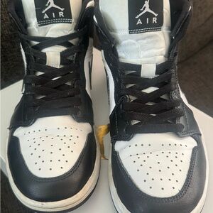 Woman’s Black and White Sneakers